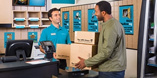 Customer and The UPS Store associate speaking at the counter in store